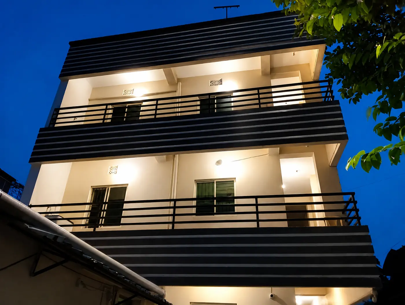 Yostel building lit up at night
