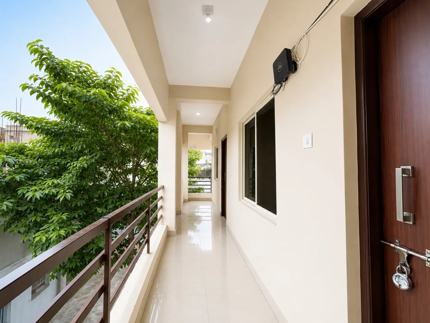 Open corridor with greenery at Yostel Jupiter