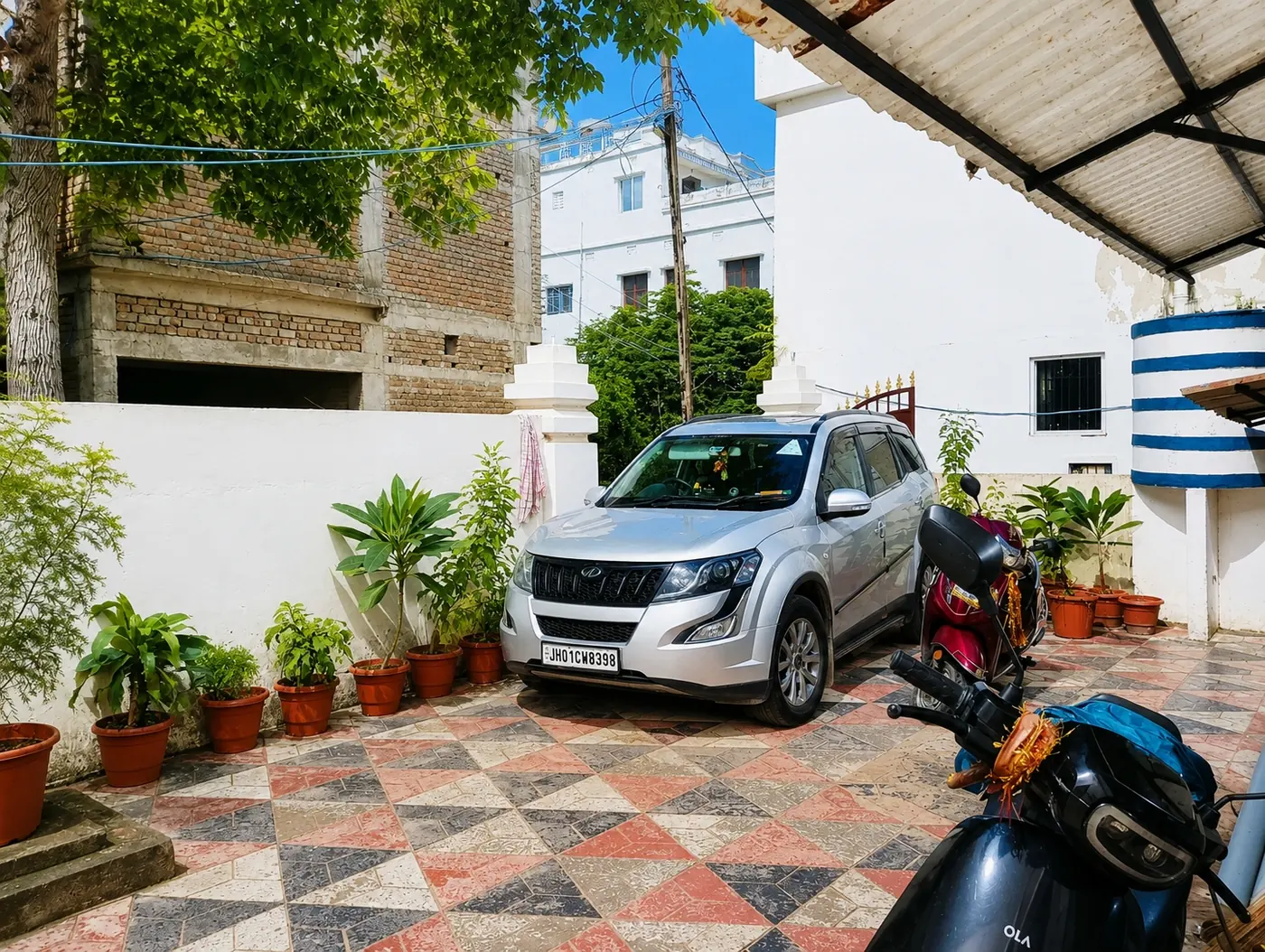 Parking space with car at Yostel Jupiter