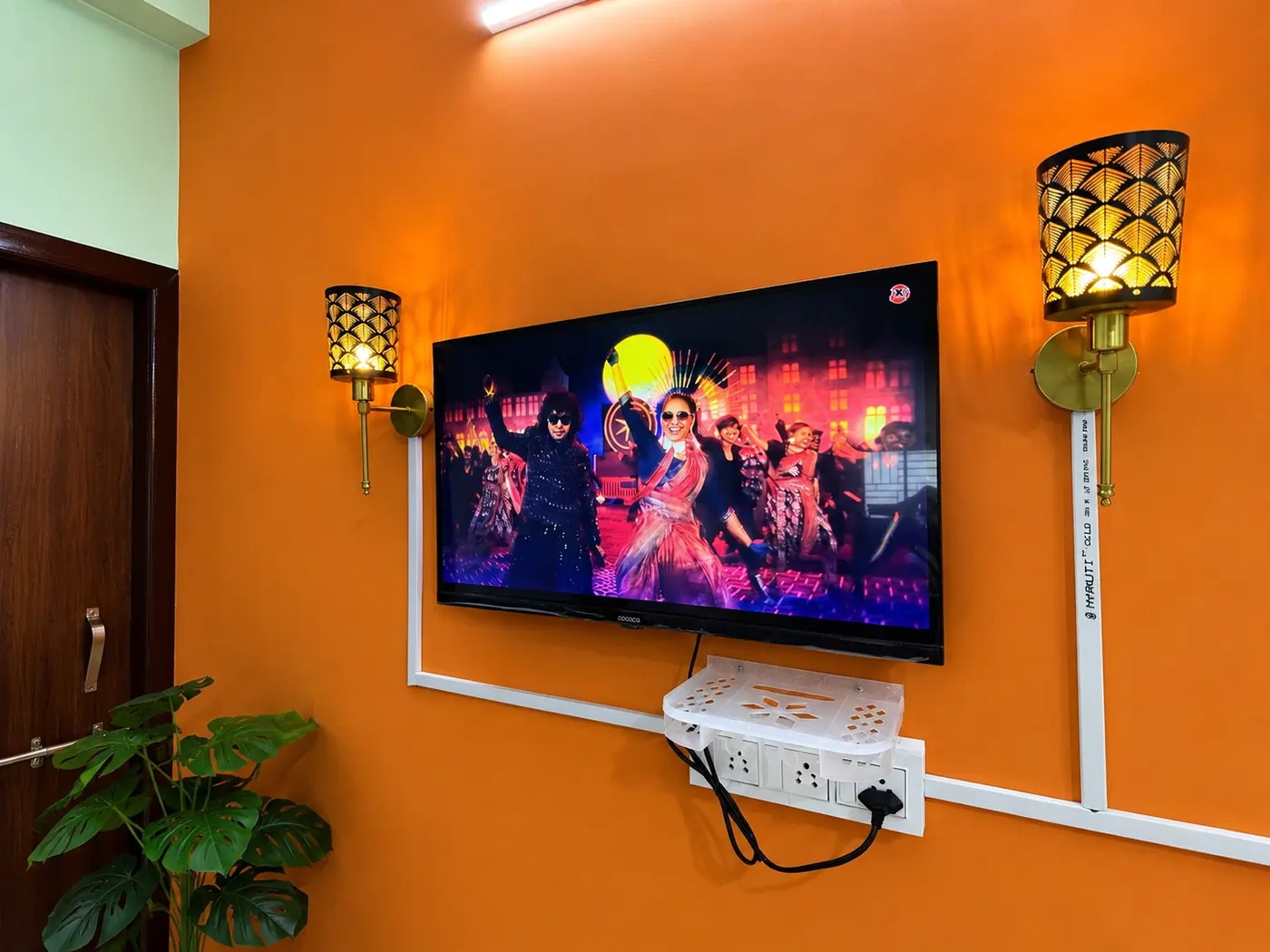 TV wall in the living room at Yostel Earth