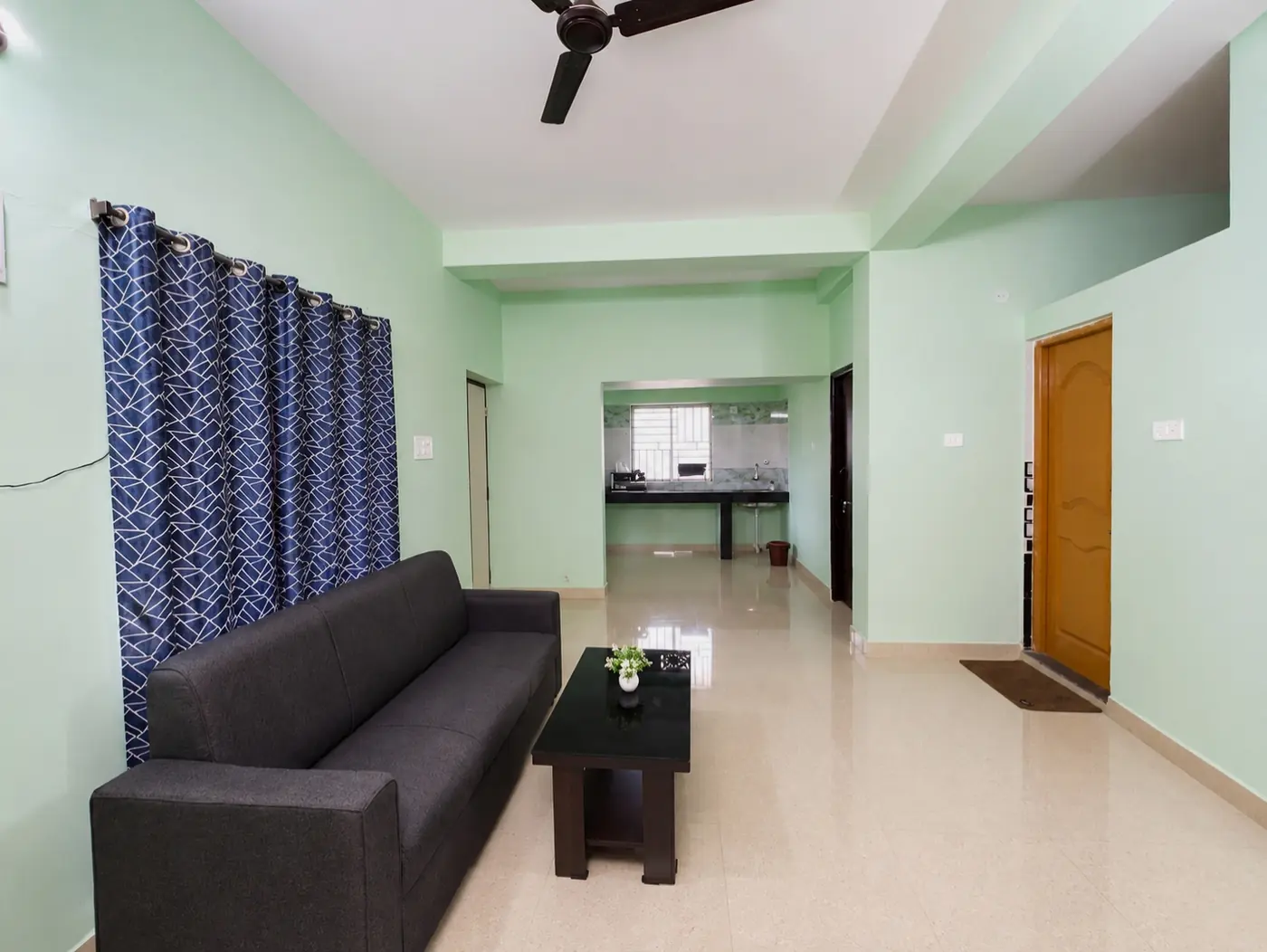 Sofa and curtains in living room at Yostel Earth