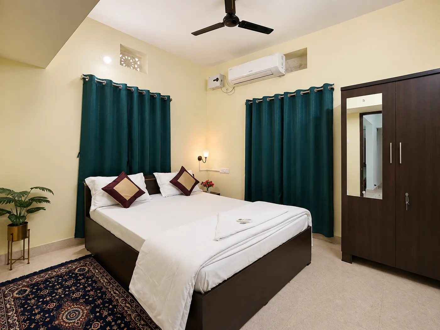 Bedroom 1 with curtains and wardrobe at Yostel Earth