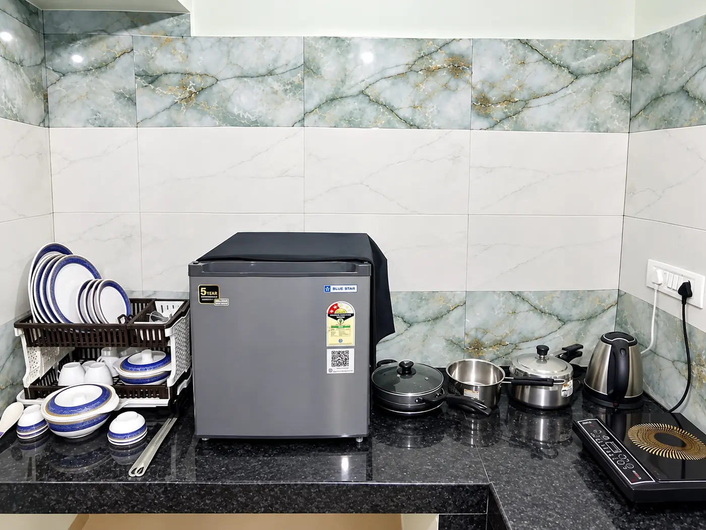 Kitchen counter with utensils at Yostel Mars